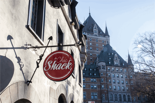 A shack next to a castle