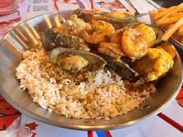 A bucket, two forks, and a lot of shrimp